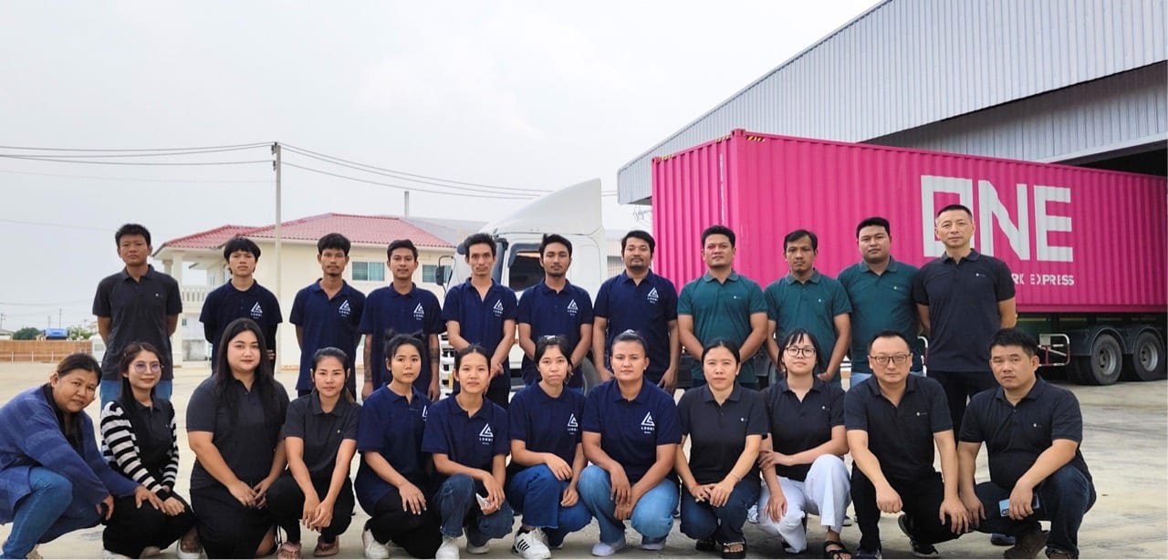 E Thai coordination team at Thailand base with export logistics vehicle